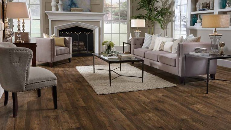 Dark stained wood look laminate in a classically elegant living room with a fireplace
